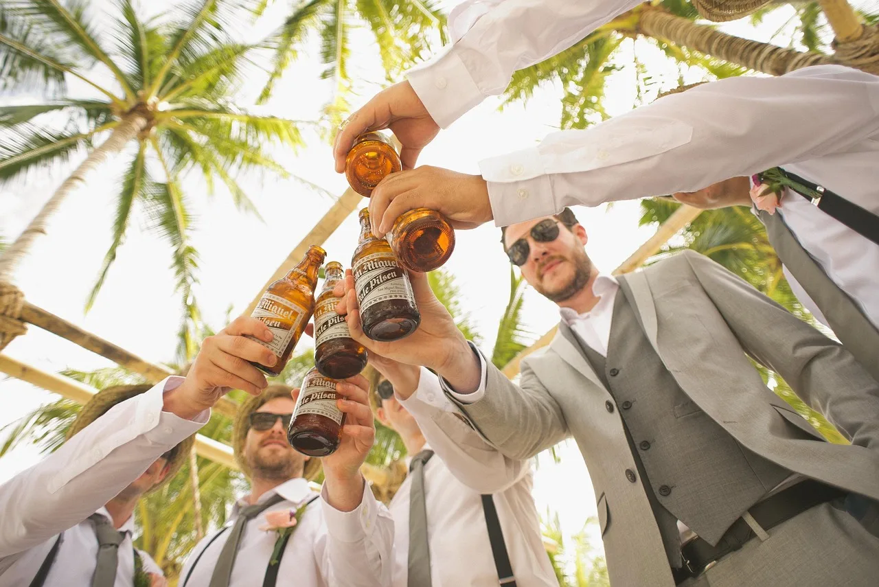 men, beers, cheers, toast, bottles, beer bottles, wedding, groom, groomsmen, group, friends, friendship, brotherhood, suits, suit and tie, formal attire, wedding photography, wedding celebration, celebrate, event, bearded men, adults, alcoholic beverages, celebration, formal coat, happy, outdoors, palm trees, people, men, cheers, wedding, friends, friends, friends, friends, friends, friendship, event. Winter review: recompute wedding planning break-even in Saturdays